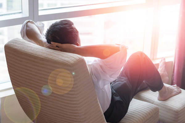 man relaxing on chair